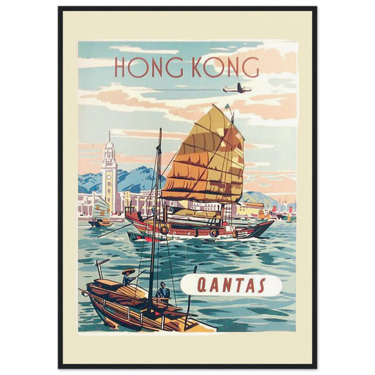 "A vintage-style Giclée art poster featuring a Qantas advertisement for travel to Hong Kong. The poster depicts a serene harbour scene with a traditional junk boat sailing in the foreground and a smaller boat with two figures in the lower left corner. In the background, there is a distant cityscape with a clock tower and two small aeroplanes flying above. The text 'HONG KONG' is at the top of the poster, and the text 'QANTAS' is in a white oval in the lower right corner. The poster has a soft, pastel colour